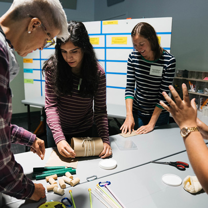 Educators participating in a building activity.