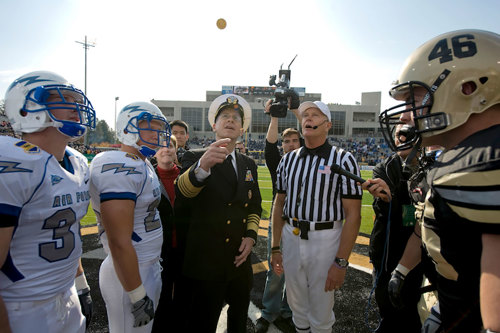 Coin flip at football game.